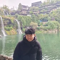 Pawee Tantivasdakarn standing outdoors